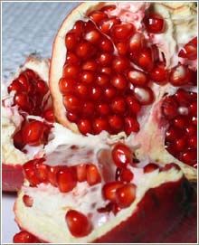 Fresh pomegranate fruit — source of pomegranate seed oil used in EcoBotanica skincare